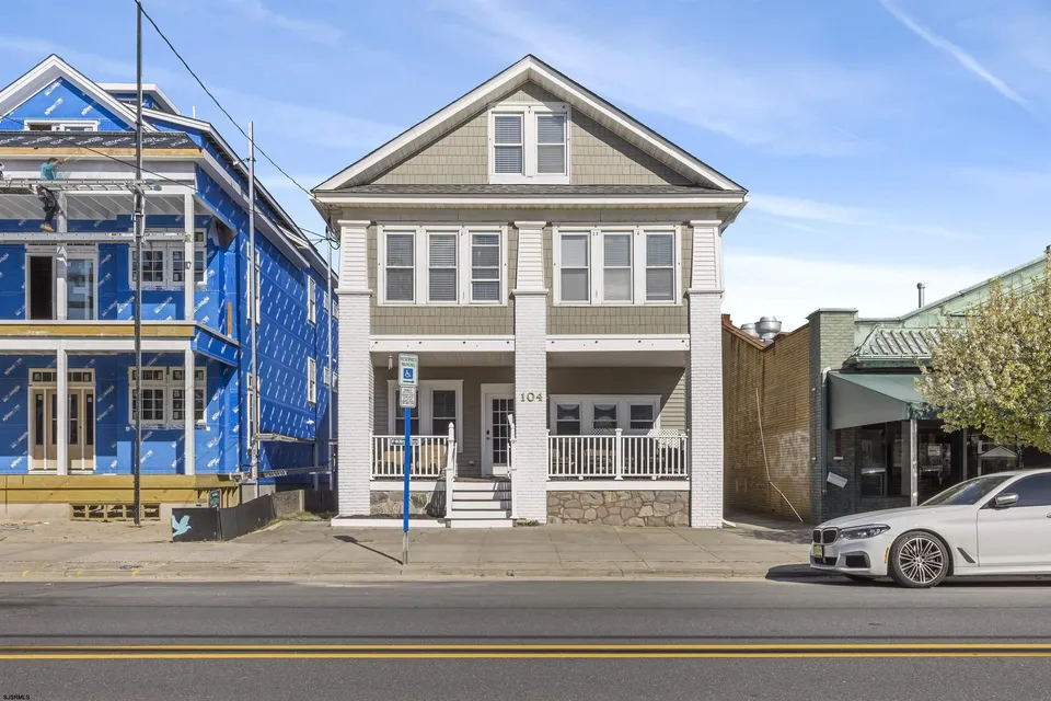 We see the front of a beige and white, two-story home in Ocean City, NJ.